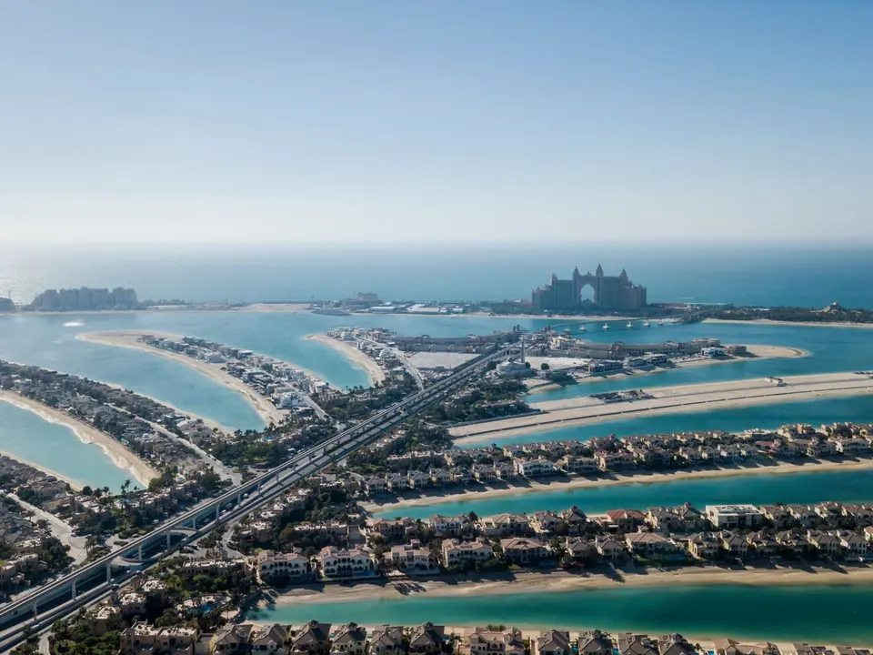 Aerial view of Palm Jumeirah villas and the Dubai coastline